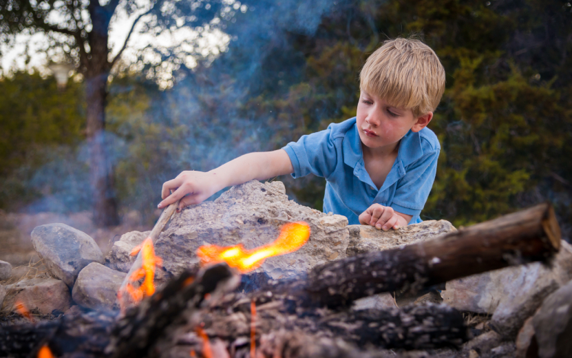 usa-texas-boy-at-camp-fire-2022.jpg