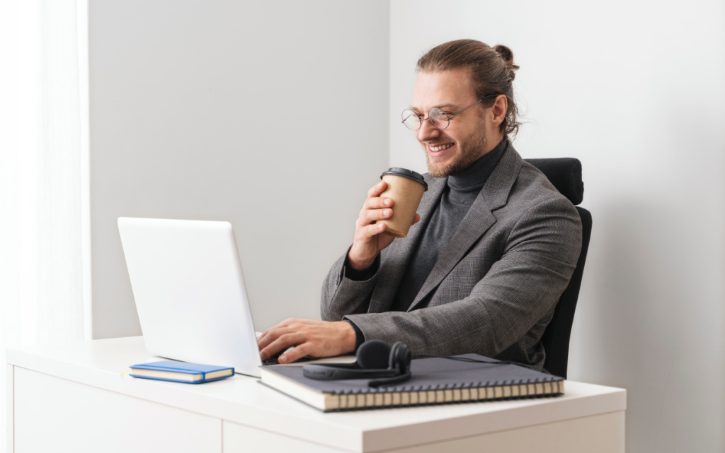 medium-shot-smiley-man-holding-cup (1).jpg