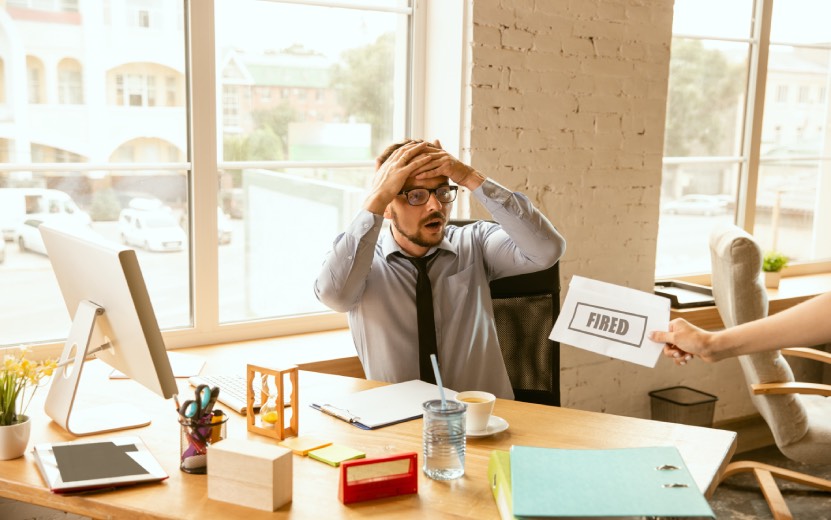 young-businessman-fired-looks-upset-has-pack-his-office-belongings-leave-work-place-new-worker-problems-occupation-stress-unemployment-new-way-life-end-career-2.jpg