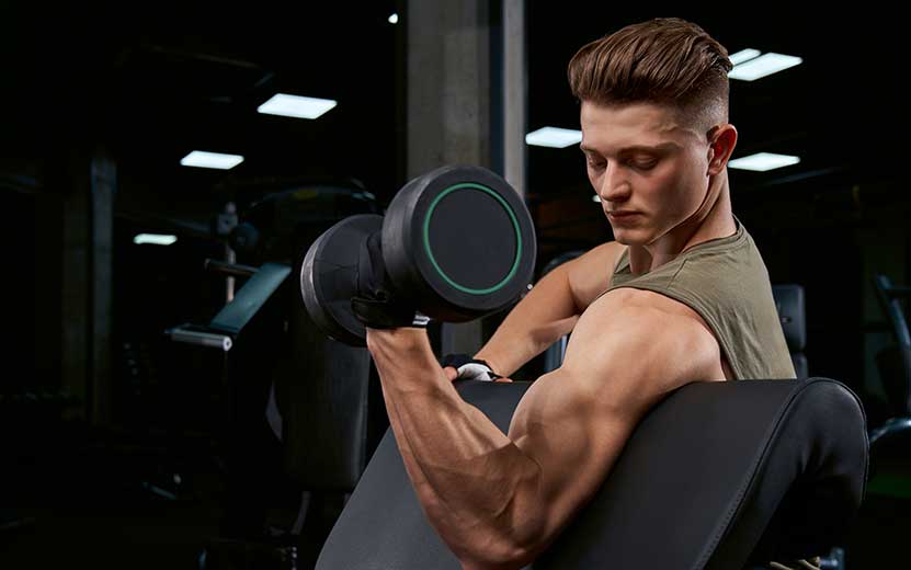 sportsman-training-biceps-with-dumbbell.jpg