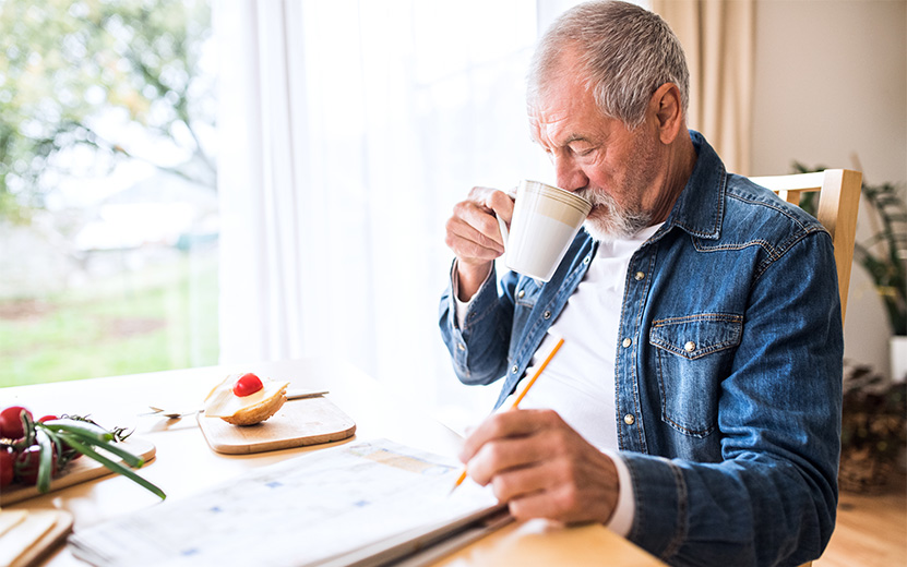 senior-man-eating-breakfast-at-home-2021-08-26-12-07-53-utc.jpg