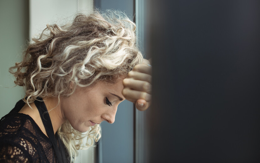 result_upset-businesswoman-leaning-window.jpg