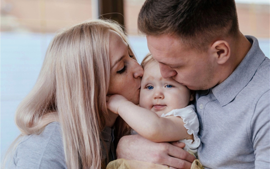loving-parents-kissing-baby-at-home-2026-03-10-01-03-40-utc (1).jpg