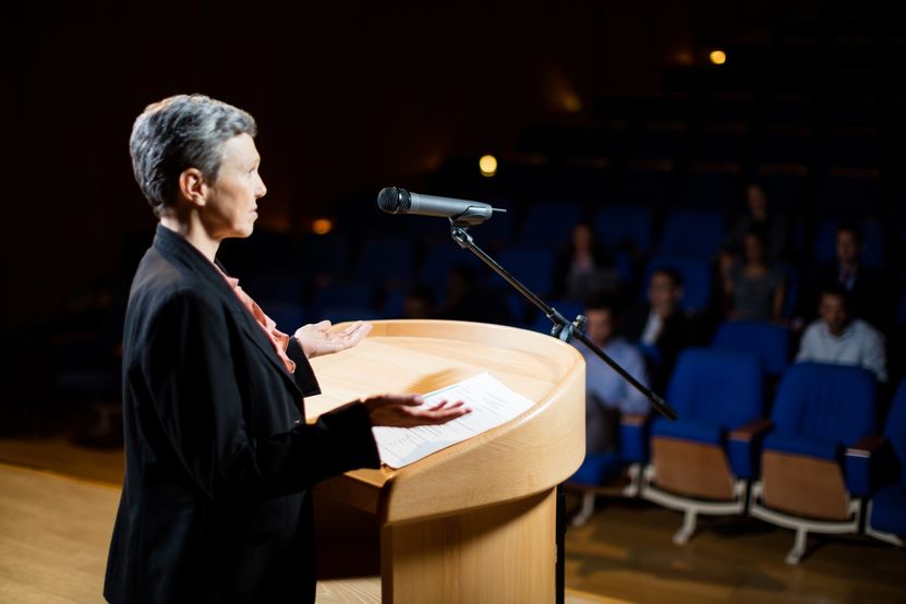 female-business-executive-giving-speech.jpg