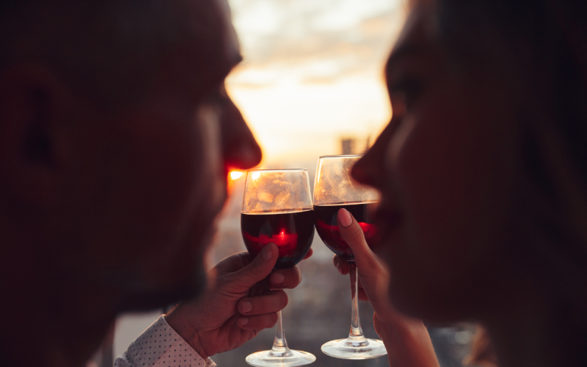 close-up-glasses-with-wine-holding-by-lovers (1).jpg