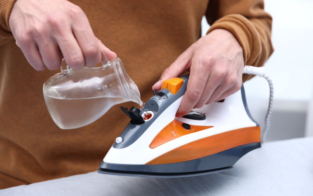 man-pouring-water-into-a-steam-iron-at-home-2026-06-15-19-21-01-utc (1).jpg
