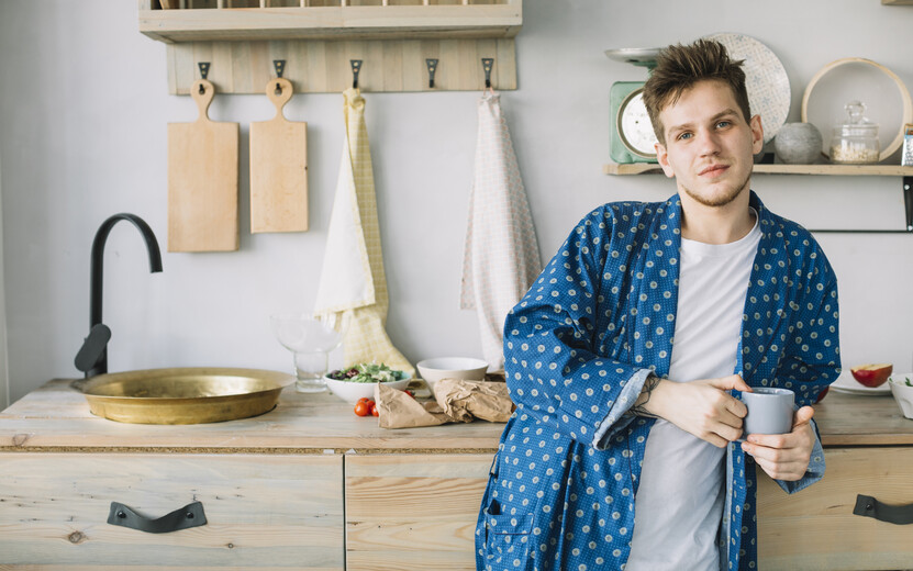 result_front-view-man-looking-camera-holding-coffee-cup-kitchen.jpg