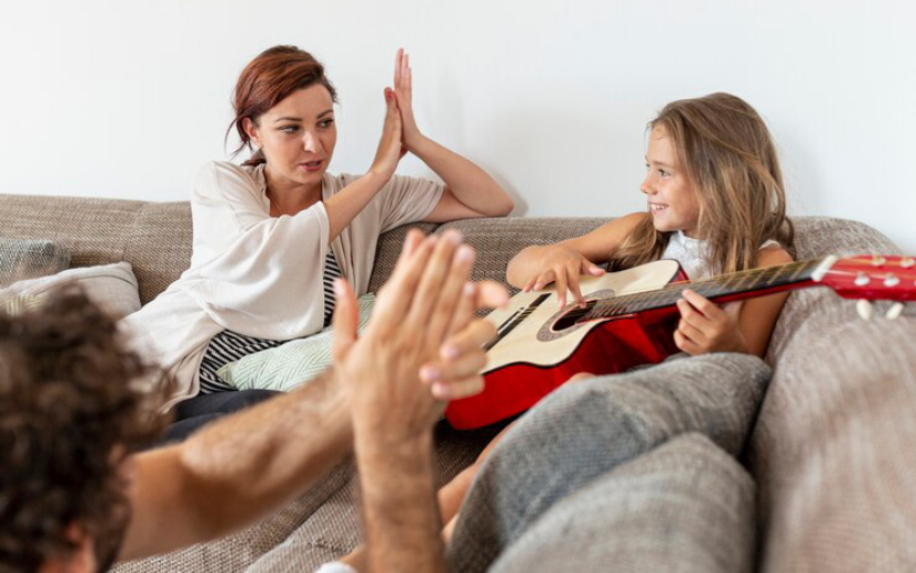 parents-clapping-their-daughter_23-2148254530 (1).jpg