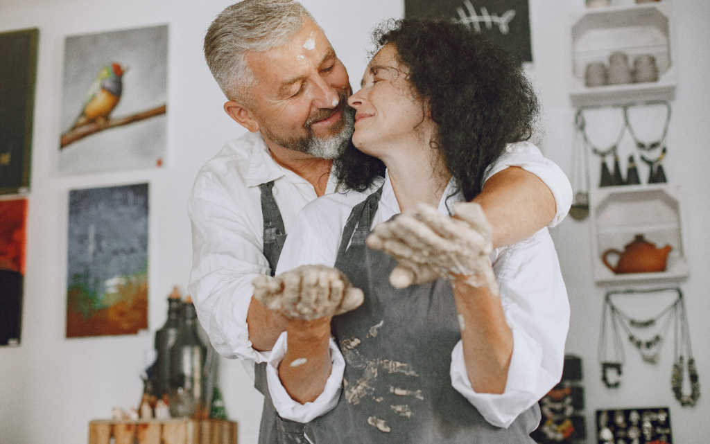 mutual-creative-work-adult-elegant-couple-casual-clothes-aprons-people-creating-bowl-pottery-wheel-clay-studio (1).jpg