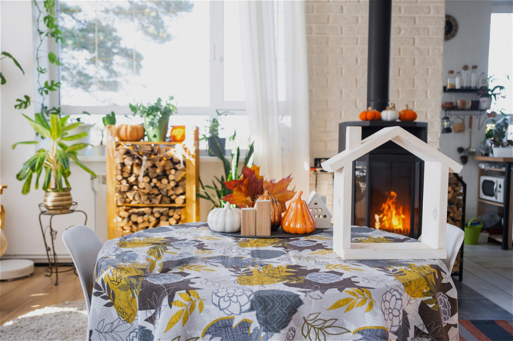 autumn-home-decor-by-fireplace-with-wooden-firewoo-2026-01-05-23-23-50-utc.jpg