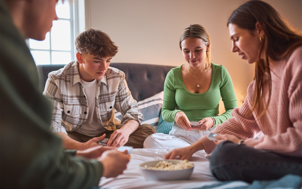 friends-enjoying-a-card-game-indoors-with-popcorn-2026-03-10-03-19-01-utc (1).jpg