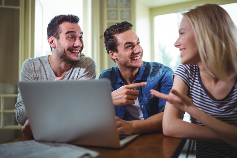 friends-sitting-table-using-laptop-cafa.jpg