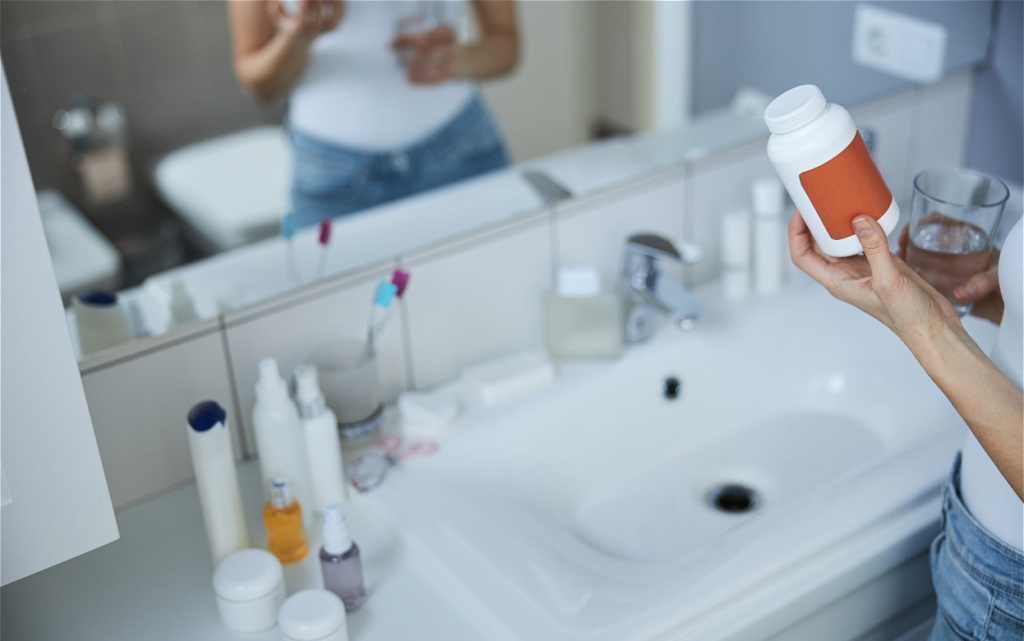 woman-holding-a-bottle-of-pills-in-bathroom-2026-01-05-06-18-16-utc (1).jpg