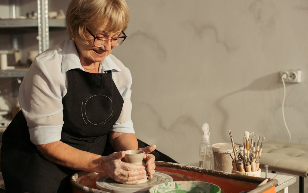 senior-woman-making-pottery-on-potter-s-wheel-in-w-2026-03-25-09-28-51-utc (1).jpg