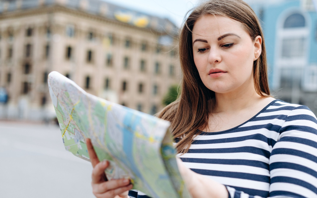 woman-navigating-city-streets-with-map-in-hand-2026-03-26-06-04-20-utc (1).jpg