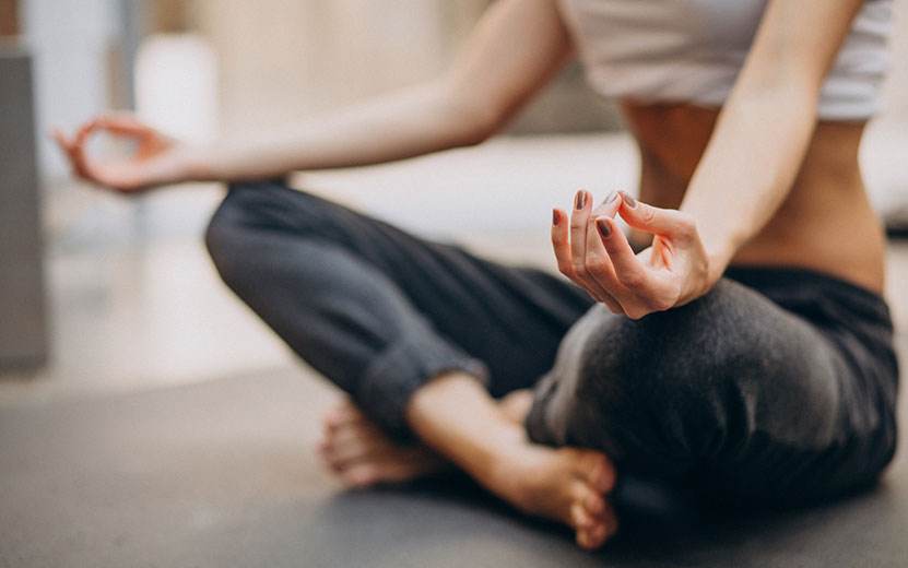 young-woman-practicing-yoga-home.jpg