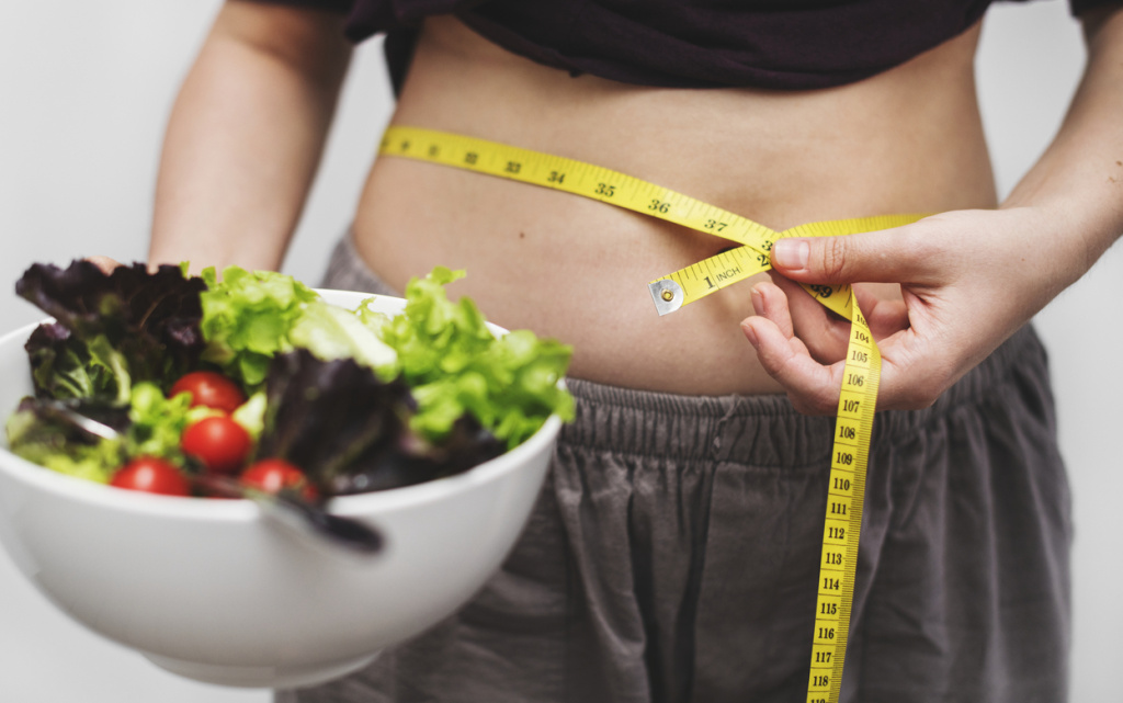 woman-measuring-her-tummy-weight (1) (1).jpg