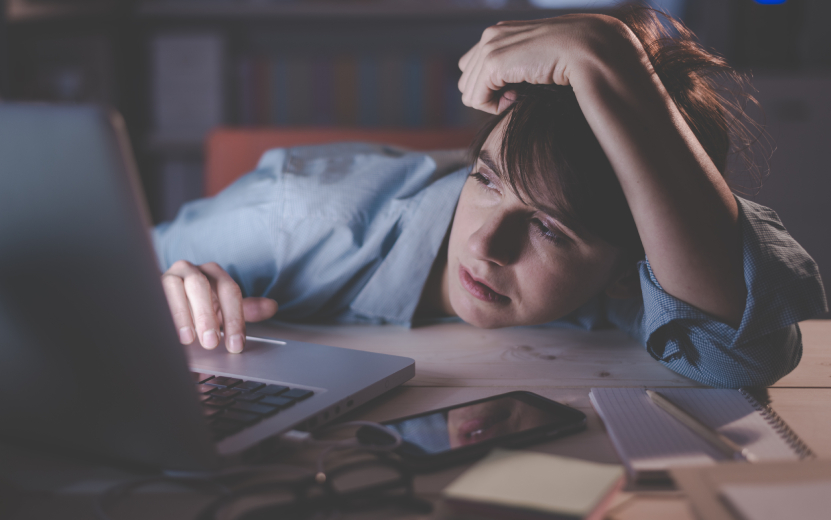 sleepy-woman-working-with-her-laptop-2023-11-27-04-59-54-utc.jpg