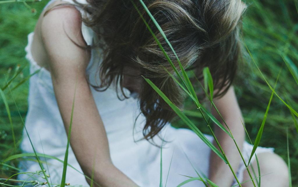 faceless-woman-sitting-field (1).jpg