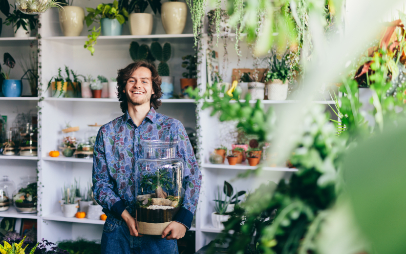 happy-man-with-plants-in-glass-jar-2023-11-27-04-57-24-utc.jpg