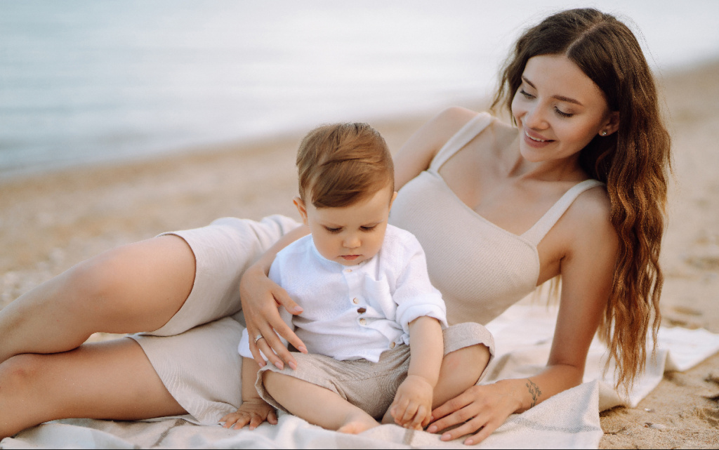 mother-and-baby-relaxing-on-beach-together-2026-03-19-09-28-24-utc (1).jpg