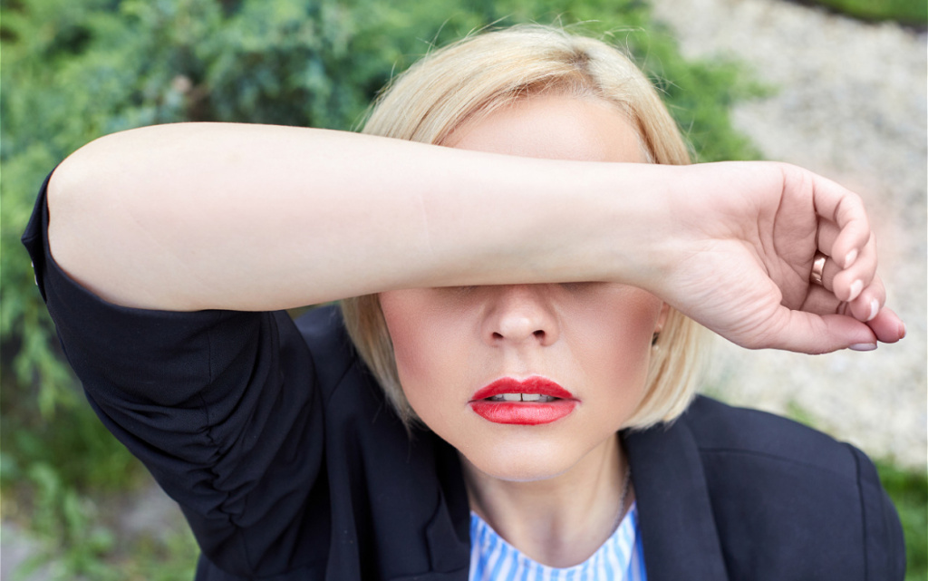 woman-with-red-lips-covering-face-with-arm-2026-03-24-12-59-28-utc (1).jpg