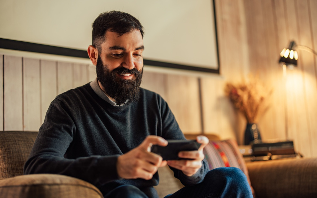 man-relaxing-and-playing-game-on-smartphone-2026-03-20-05-45-35-utc (1).jpg