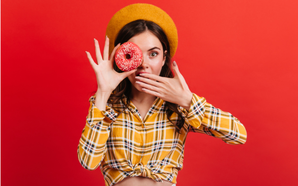 close-up-portrait-amazed-green-eyed-girl-holding-tasty-donut-lady-beret-shirt-covers-her-mouth (1).jpg