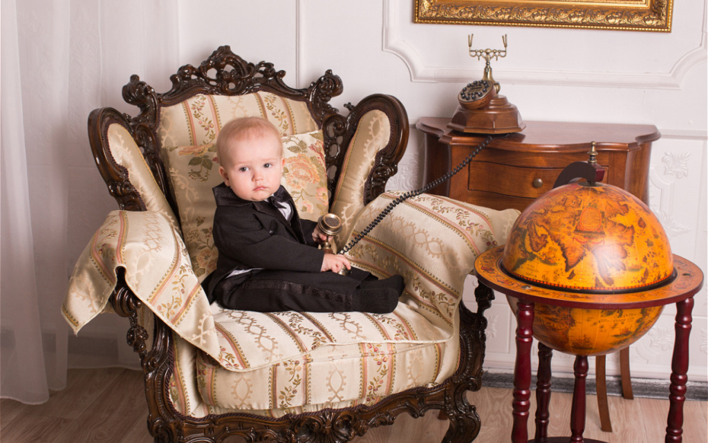 child-in-a-tuxedo-sitting-in-an-office-talking-on-2026-03-17-00-36-24-utc (1).jpg