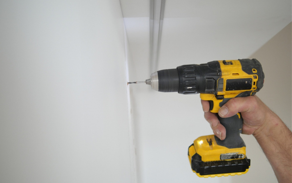 using-electric-drill-on-a-wall-indoors-2026-03-17-00-11-21-utc (1).jpg