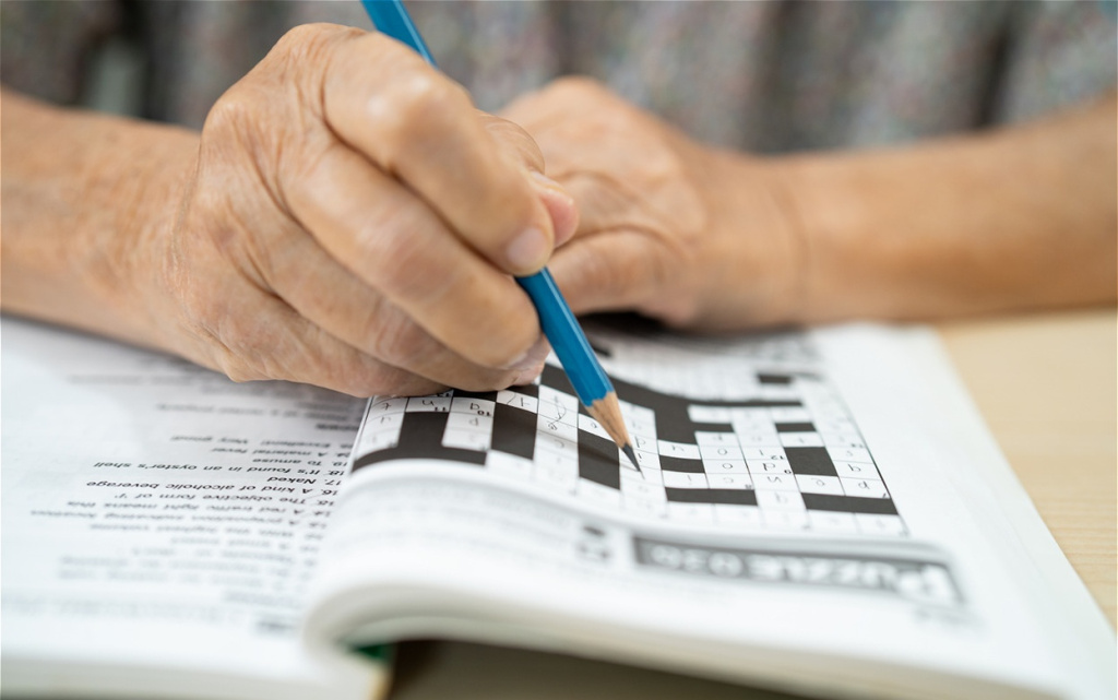 senior-adult-completes-crossword-puzzle-with-penci-2026-01-11-10-11-48-utc (1).jpg
