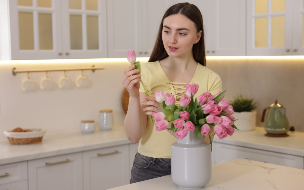 woman-arranging-pink-tulips-in-bright-white-kitche-2026-03-27-00-39-40-utc (1).jpg