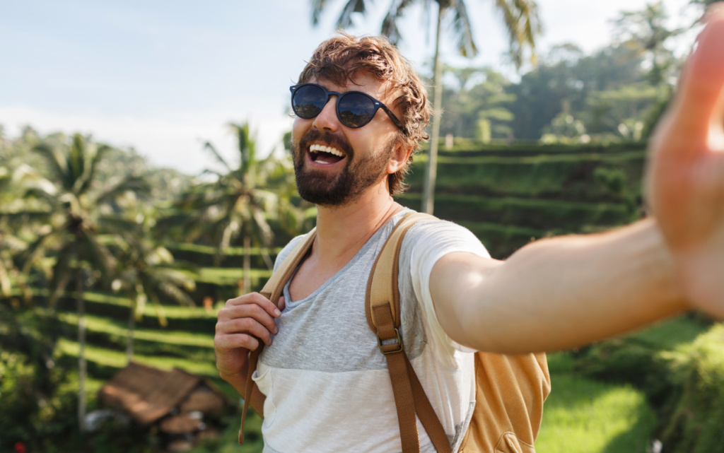 happy-stylish-caucasian-man-with-backpack-travel-rice-plantation-making-self-portrai-memories (1).jpg