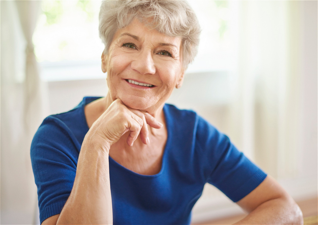 smiling-senior-woman-resting-chin-on-hand-2026-03-13-01-47-53-utc.jpg