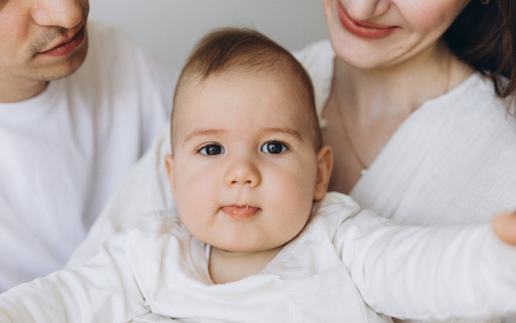 happy-family-embracing-newborn-baby-at-home-2026-01-08-02-08-21-utc (1).jpg