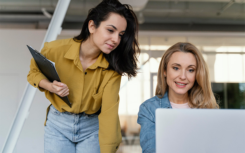 women-checking-work-project-together.jpg