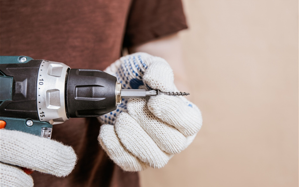 close-up-of-hand-with-gloves-holding-screw-2026-03-25-07-24-14-utc (1).jpg