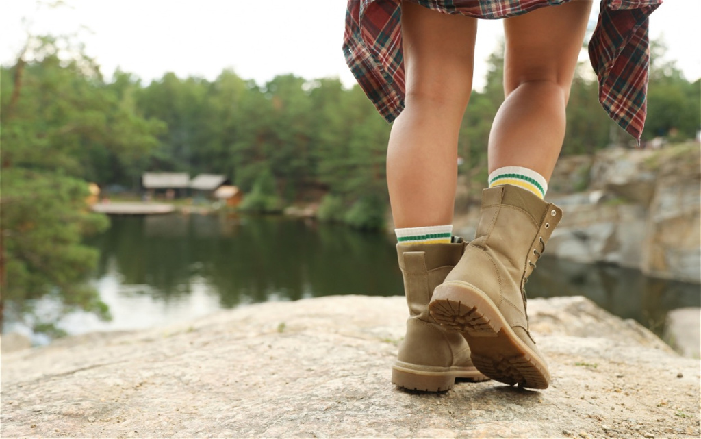 legs-with-boots-on-a-rock-by-a-lake-2026-09-22-12-16-32-utc (1).jpg