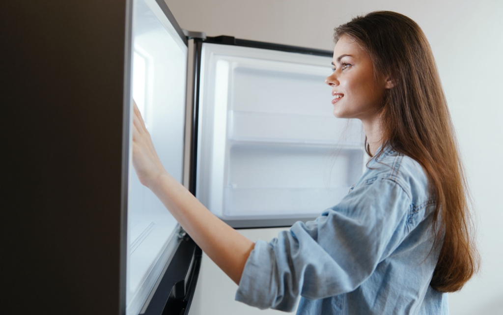 woman-opening-refrigerator-door-looking-inside-2026-03-24-06-26-22-utc (1).jpg