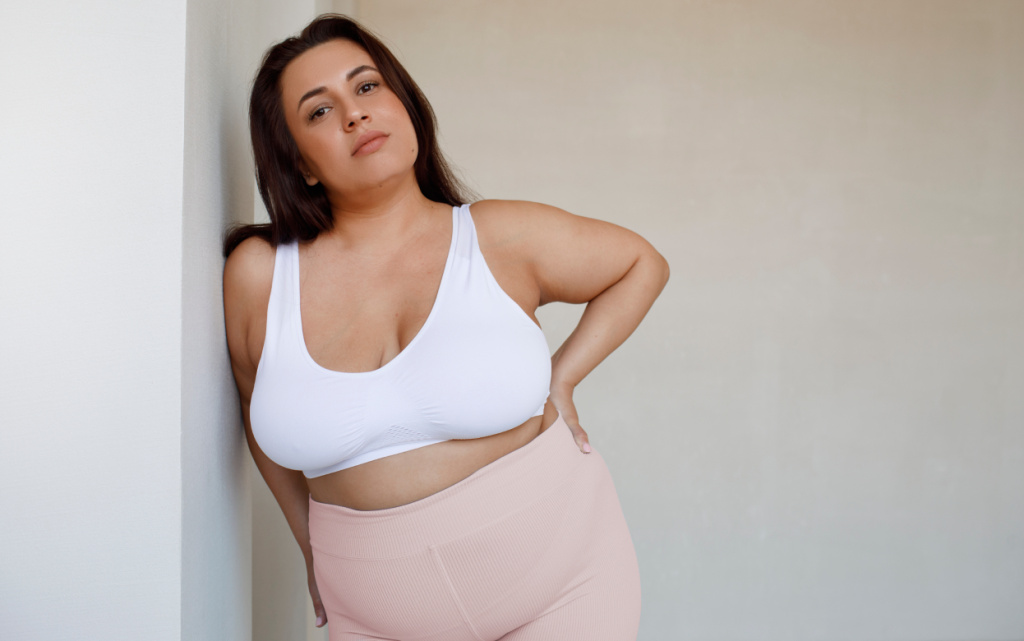 medium-shot-plus-size-model-posing-studio (1).jpg