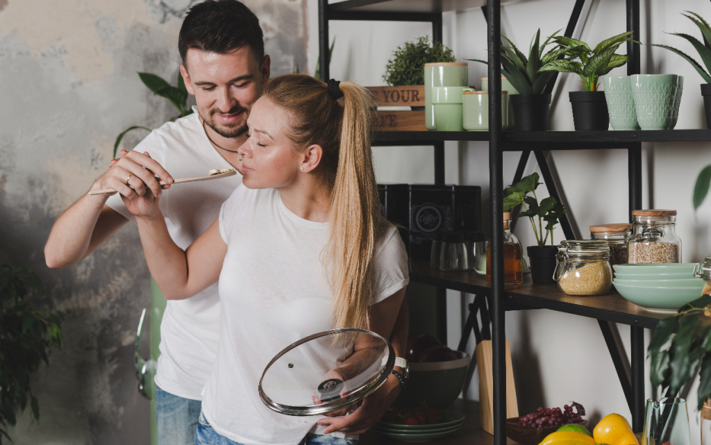 couple-tasting-prepared-mushroom-kitchen (1).jpg