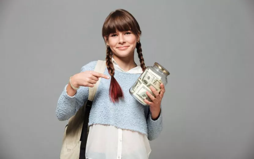 girl-standing-with-jar-full-money_171337-4705.jpg
