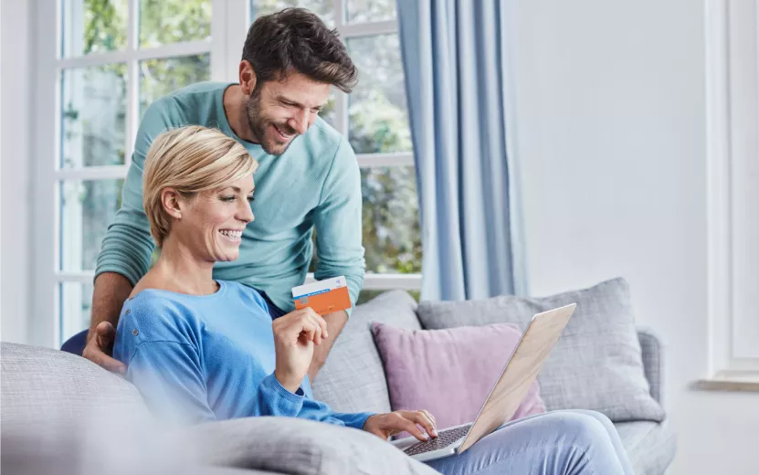 happy-couple-at-home-shopping-online-2023-11-27-04-50-02-utc.jpg