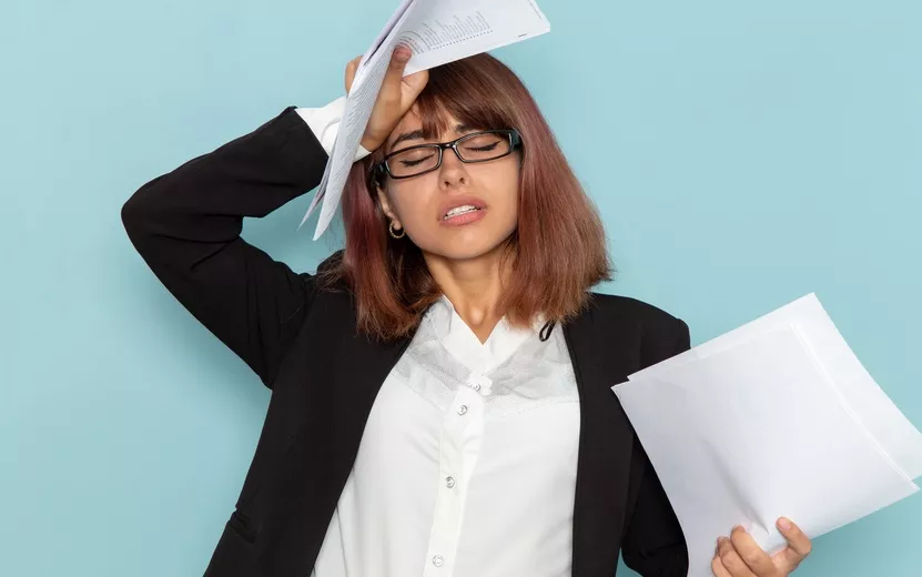 front-view-female-office-worker-holding-different-paperwork-blue-surface (1).jpg