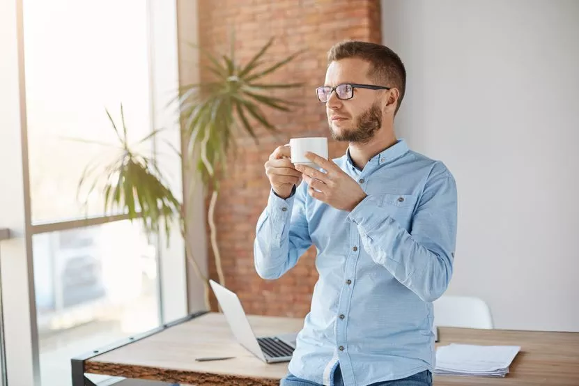 portrait-mature-unshaved-caucasian-businessman-glasses-classical-shirt-standing-light-office-drinking-coffee-relaxing-break-business-concept.jpg