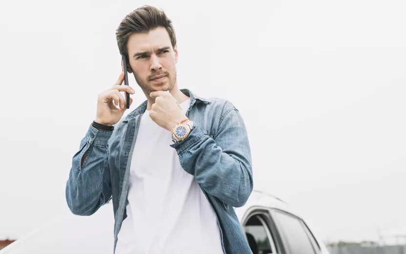 result_thoughtful-young-man-talking-cellphone-standing-near-window.jpg