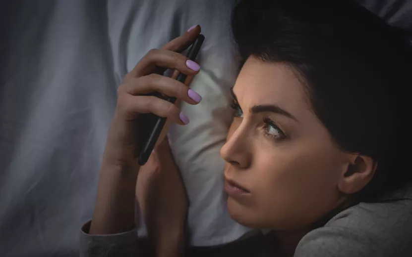 top-view-of-awake-woman-with-insomnia-using-smartp-2023-11-27-05-35-18-utc (1).jpg