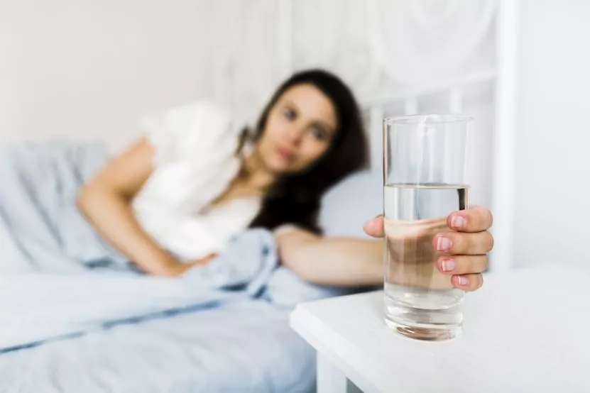 female-bed-holding-glass-water.jpg female-bed-holding-glass-water.jpg