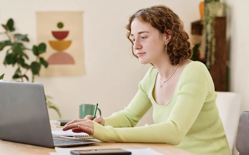 young-confident-businesswoman-making-notes-while-w-2023-11-27-04-57-33-utc.jpg