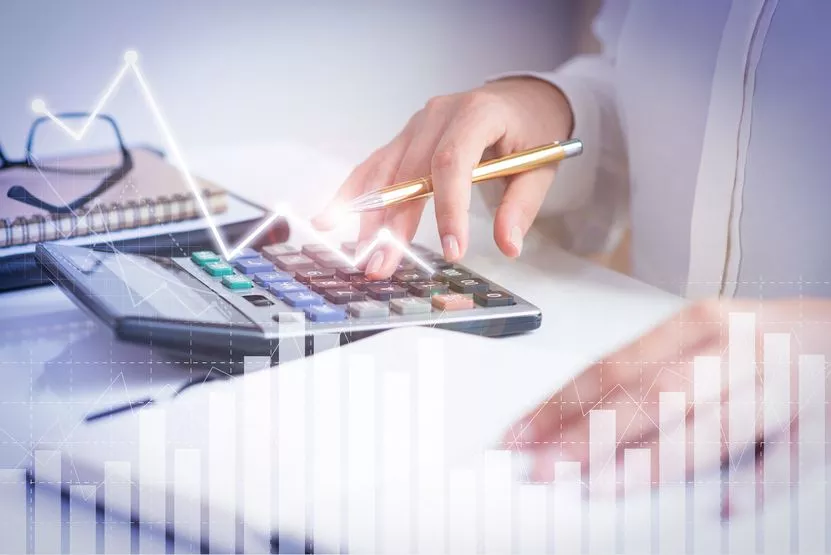 accountant-calculating-profit-with-financial-analysis-graphs.jpg
